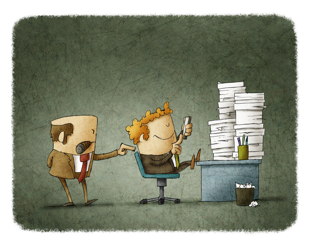 Avoid Hiring The Wrong People: Hire Slow Fire Fast Employee using his smartphone at workplace