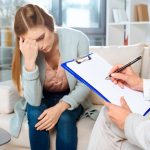 pcos-woman-doctor-office-sad-worried